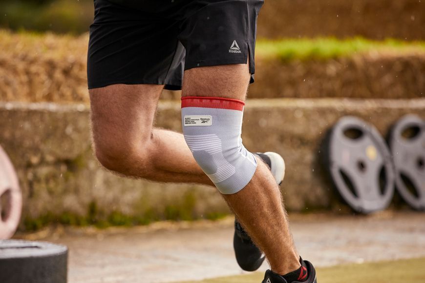 Фіксатор коліна Reebok Speedwick Knee Support білий, червоний Уні M RRSU-14324 фото